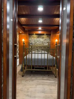 a bedroom with a bed in a room at To Petrino 5 -Apartment- Nature, Comfort & Tradition Under One Roof in Kalopanayiotis