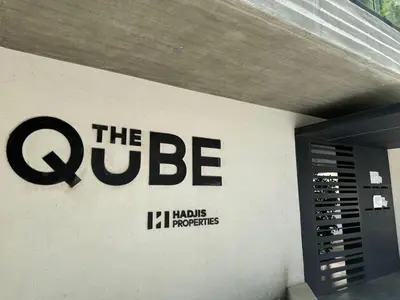 a sign on the side of a building at The Qube Residence 2 Bedroom Premium Apartment in Limassol