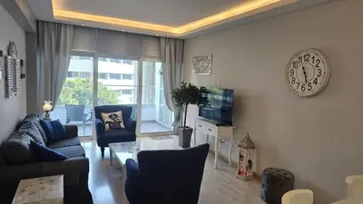 a living room with a couch and a tv at STAY Armonia Central Suite in Nicosia