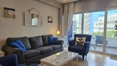 a living room with a couch and two chairs at STAY Armonia Central Suite in Nicosia