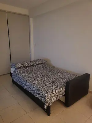 a bedroom with a bed with a leopard print spread at Sea View Valley Retreat in Voroklini