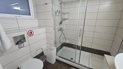 a bathroom with a shower and a toilet at STAY Fantasia Central Suite in Nicosia