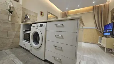 a laundry room with a washer and dryer at STAY Fantasia Central Suite in Nicosia