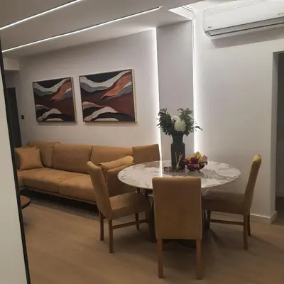 a living room with a table and a couch at Amato Beach in Limassol