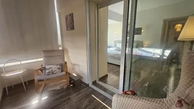 a room with a mirror and a chair and a bed at STAY Vintage Central Suite in Nicosia