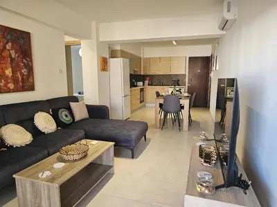 a living room with a couch and a table at Horizon View 2 in Kiti