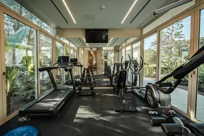 a gym with treadmills and elliptical machines at Averde Residence in Larnaka