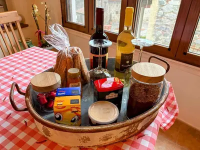 a basket filled with bottles of wine on a table at The Lodge Kampi by Thea Suites