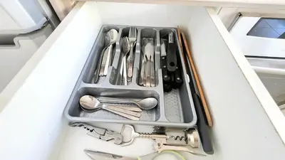 a tray of utensils in a drawer in a kitchen at 2BR Apartment with Pool & Free Wi-Fi in Larnaka
