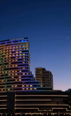 a tall building with a santa ana sign on it at Grand Sappfıre Resort Iskele in Larnaka
