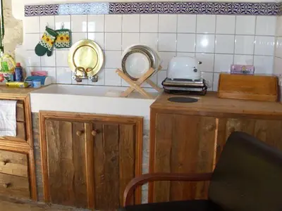 a kitchen with a sink and two mirrors on the counter at Historic 600 years old beautifully renovated Mill House in Meniko