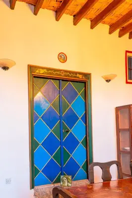 a door with a cat sitting in front of it at The Historical Cypriot House, Beautifully Renovated Traditional Stone House in Ayios Ioannis