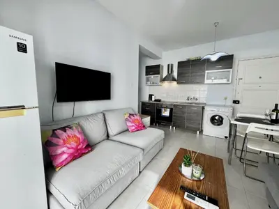 a living room with a couch and a table at STAY McKenzie Mile in Larnaka