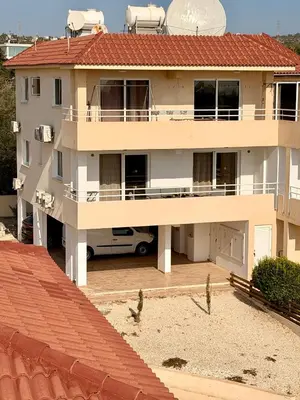 a large white house with a red roof at Rope and Reef 2BD Walk to Nissi Beach and Pool in Ayia Napa