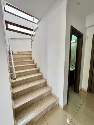 a staircase in a house with a stair railing at Aurora Gardens Villa Spacious 3 Bedroom in Protaras in Paralimni