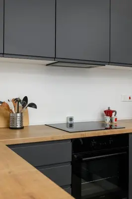 a kitchen with a counter top and a black oven at Bright 2BR by Pedieos Park, near Old Town in Nicosia