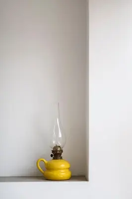 a yellow glass lamp sitting on a shelf at Bright 2BR by Pedieos Park, near Old Town in Nicosia