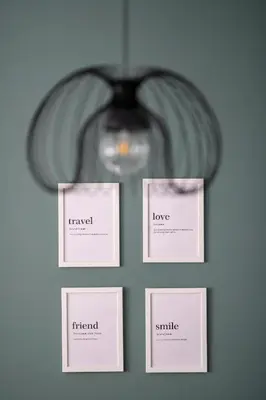 a group of four cards on a wall with a light at Bright 2BR by Pedieos Park, near Old Town in Nicosia