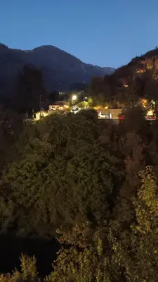 a view of a field with trees and lights at Cecilia Traditional House-Suites in Kalopanayiotis