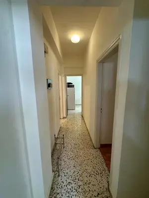an empty hallway with a room with a hallwayngthngthngthngthngthngthngth at 2 bedroom flat by the sea in Larnaka