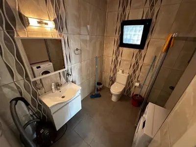 a small bathroom with a sink and a toilet at Avrasya site, Luxury one-bedroom apartment in Kyrenia city center