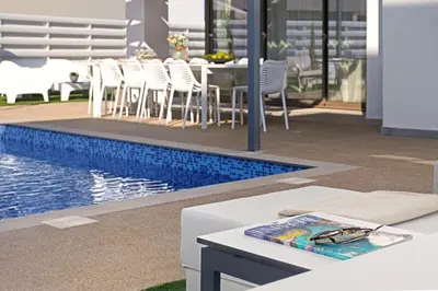 a pool with chairs and a table next to a pool at Villa Elizabeth - Pernera Resort Center in Paralimni