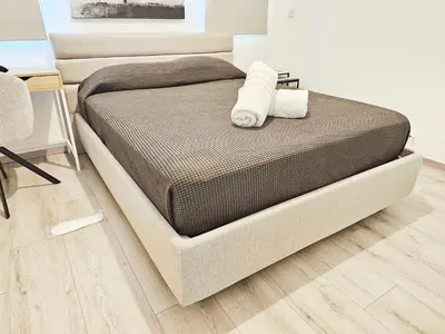 a bed with two pillows on it in a bedroom at Alexander Residence Trikallon Str in Nicosia