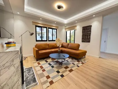 a living room with a couch and a table at GameHouse in the City Center in Nicosia