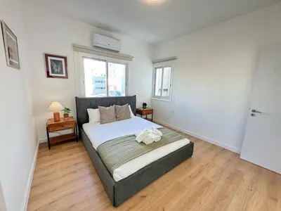a bedroom with a large bed in a room at Cozy Boho 2-BR Retreat in Central Nicosia in Nicosia