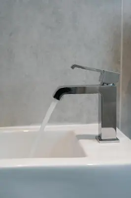 a sink with a faucet on top of it at Larnaca Salt Lake Gem, Airy 2 BDRM Apartment in Larnaka