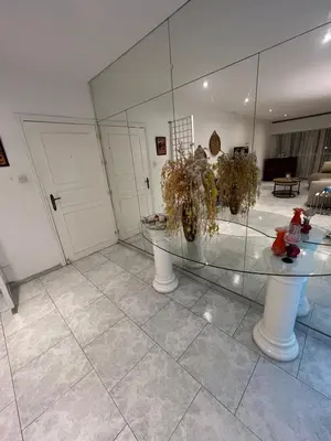 a room with two tables and a glass table at City Center Getaway in Nicosia