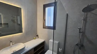 a bathroom with a sink and a glass shower at STAY Engomi Gem 2 in Engomi