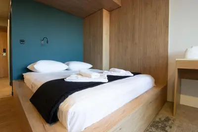 a bedroom with two beds with towels on them at M-Studios - Luxury studios in the heart of Limassol in Limassol