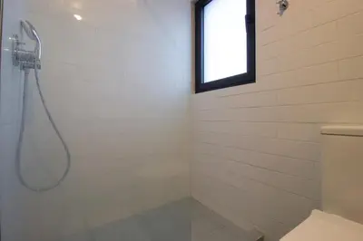 a bathroom with a shower with a window at M-Studios - Luxury studios in the heart of Limassol in Limassol