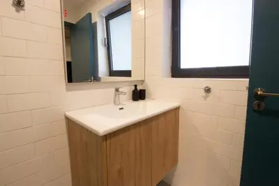 a bathroom with a sink and a mirror at M-Studios - Luxury studios in the heart of Limassol in Limassol
