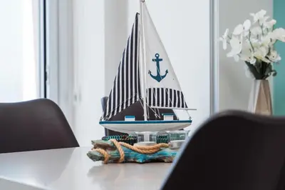a toy boat sitting on top of a table at SunnyVillas Suite Mythical GYM Swimming Pool S19 in Paralimni