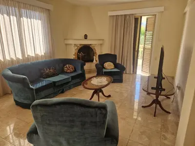 a living room with a couch and chairs and a table at Urban Nest Central Nicosia - Spacious 2BR Apartment in Nicosia