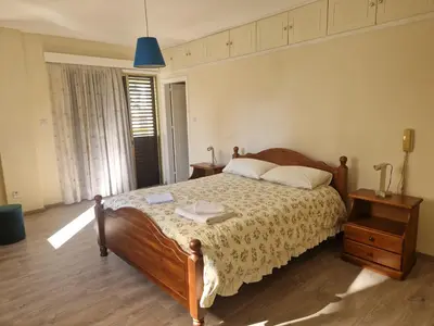 a bedroom with a bed and a blue light at Urban Nest Central Nicosia - Spacious 2BR Apartment in Nicosia