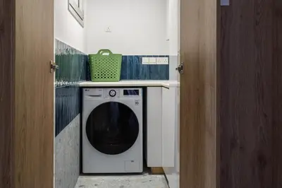 a washer and dryer in a small room at Modern Luxury 2BR|Park View & Balcony in Nicosia