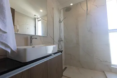 a bathroom with a sink and a shower at Mythical Blue Villas in Protaras