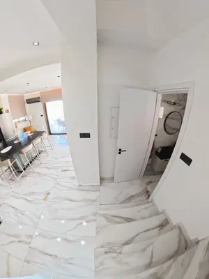 a room with white walls and marble flooring at Mediterranean Sunrise Villa Protaras in Paralimni