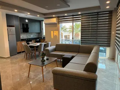 a living room with a couch and a table at Veray Homes in Nicosia
