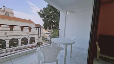 a balcony with a table and chairs and a view at STAY Terra Cota Studio in Limassol