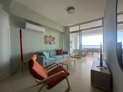 a living room with a couch and a table at Breathtaking Sea and Marina View City Center 2 bdr in Larnaka