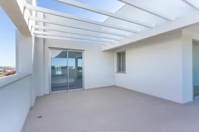 an empty white room with a skylight at BlueStar Limassol Suites in Limassol