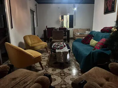 a living room filled with furniture and a christmas tree at Mountain Retreat in Kakopetria, Cyprus - Perfect for Families in Kakopetria