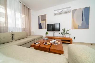 a living room with a couch and a coffee table at 2 bedroom flat in Strovolos
