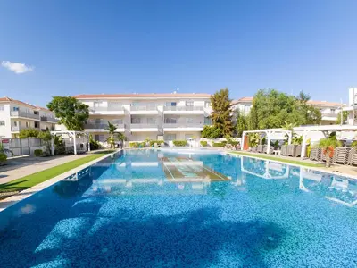 a large swimming pool in front of a building at Mythical Sands 2 - E in Paralimni
