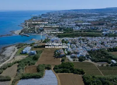 an aerial view of the village of akiryu and the beach ardopolos at Ayia Triada Beach Gardens in Protaras
