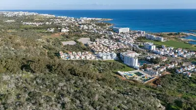 an aerial view of a city and the ocean at Green Bay Villa #12 in Protaras